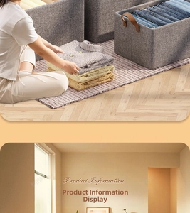 Close-up of grey fabric storage box with leather handle and folded clothes inside