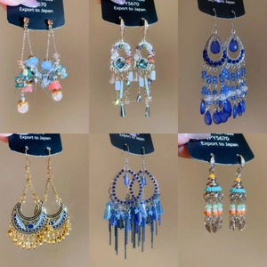 Detailed views of vintage leaf tassel earrings with rhinestones and beads in various styles
