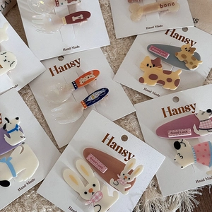 Set of cute cartoon animal hair clips including bunny and cat on brand display cards