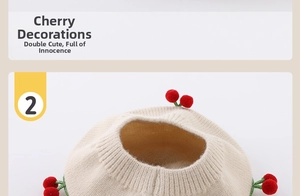 Detail of baby beige knitted hat featuring handmade 3D cherry decoration with stem