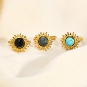 Ensemble détaillé de bagues de tournesol dorées avec turquoise et pierre de marbre