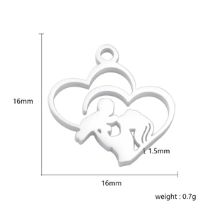 Macro detail of heart pendant showing mother and child silhouette and 16mm dimensions