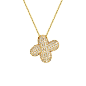 Macro detail of 18K gold plated clover pendant set with shimmering white cubic zirconia
