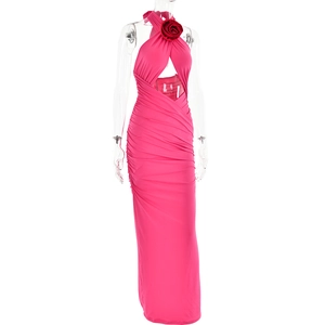 Detail of pink halter dress featuring a red rose ornament and side waist cut-outs