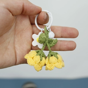 Handmade crochet Lily of the Valley flower keychain in yellow with white bell charm