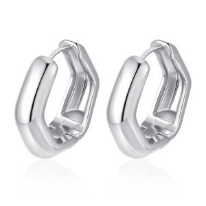 Detailed view of polished silver geometric earrings with a modern hexagonal design