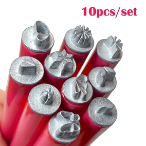 Close-up of 10-piece nail art stamp pen set showing diverse metal pattern tips