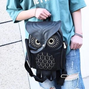 Women's black owl-shaped PU backpack with embroidered feather textures and metal eyes