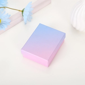 Blue and pink gradient jewelry gift box with minimalist floral background setup