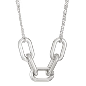 Macro view of interlocking silver chunky oval links on a punk style geometric necklace