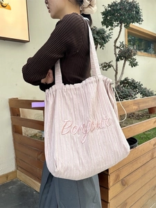 Pink striped canvas tote bag with Bonjour embroidery and drawstring closure for daily use