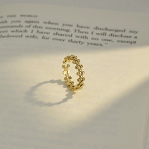 Minimalist gold beaded stainless steel ring with adjustable open design and glossy finish