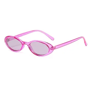 Vintage oval sunglasses with translucent pink frame and light gray lenses for women