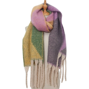 Close-up of thick multi-color mohair-like scarf with chunky tassel detail on mannequin