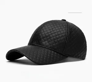 Detail of black PU leather baseball cap with quilted diamond pattern and stitching