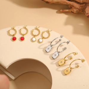Titanium steel hoop earrings set with star engraved pendants and colorful stone charms