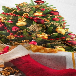 Detailed close-up of Christmas tapestry with festive tree, red stockings, and gift boxes
