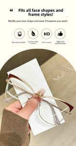 Detailed view of cat-eye metal glasses frame with burgundy accents and golden finish