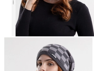 Detailed close-up of the grey and black checkered knit beanie and matching neck warmer set