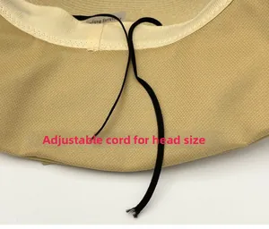 Detail view of khaki straw hat interior with adjustable drawstring and inner sweatband