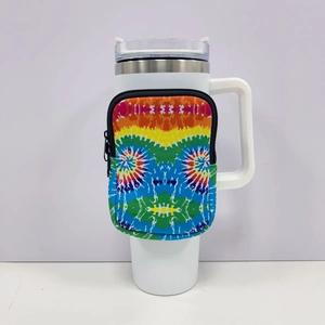 Detail of white 40oz tumbler sleeve featuring a vibrant rainbow tie-dye zipper pouch