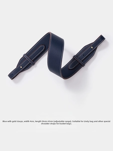 Detail of adjustable 4cm wide navy lychee leather strap with gold buckles for handbags