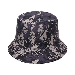 Detailed close-up of digital pixel camouflage pattern on a canvas outdoor bucket hat