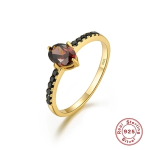 Detailed macro shot of S925 sterling silver ring with oval garnet and S925 stamp