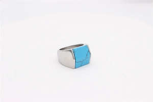 Detailed view of square blue turquoise inlay on a wide silver titanium steel ring for men