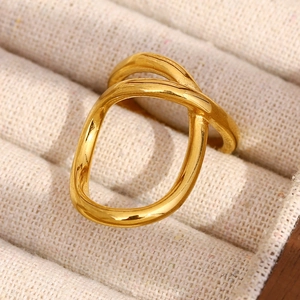 Macro shot of 18K gold-plated stainless steel double-ring with wavy geometric design