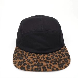 Detail view of five-panel baseball cap with black canvas and leopard print brim