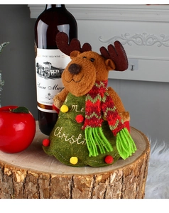 Knitted reindeer wine bottle cover on wood with Merry Christmas embroidery and red wine