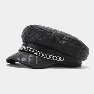 Close-up of black quilted PU leather sailor hat featuring a chunky silver metal chain