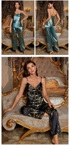 Detail of floral silk pajama set featuring v-neck camisole and long pants in dark teal