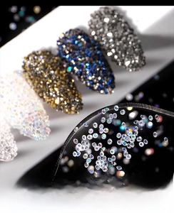 Macro shot of iridescent crystal nail beads and rhinestones on diverse manicure styles