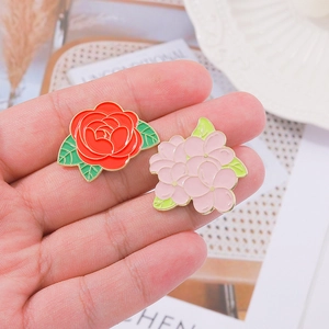 Vibrant enamel floral brooch set featuring red rose and pink flower on alloy metal