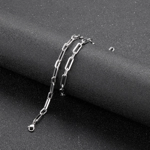 Close-up of silver stainless steel geometric square link chain necklace with lobster clasp