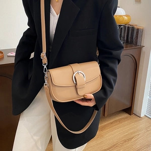 Chic retro saddle shoulder bag in khaki PU leather with a silver circular buckle detail