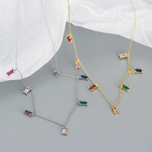 Detail of s925 silver necklaces with colorful rectangular zircon gemstones in gold and silver