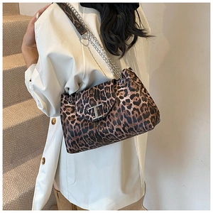 Close-up of leopard print shoulder bag with silver chain strap and metal T buckle