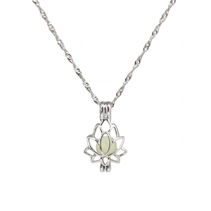 Elegant luminous lotus pendant necklace in silver with light green bead on white background
