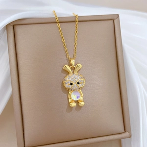 Luxurious gold titanium steel necklace featuring a crystal bunny with a cat eye stone