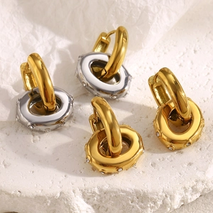 Two-tone stainless steel oval earrings with 18K gold plating and zircon stone accents