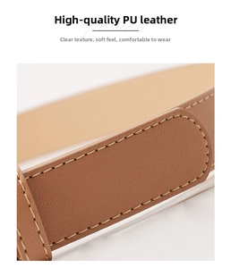 Detailed macro view of brown lychee grain PU leather belt with fine stitching