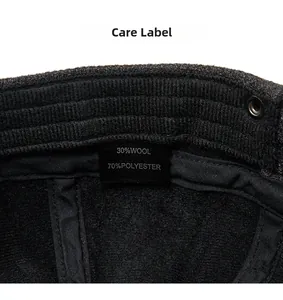Care label showing 30% wool and 70% polyester material details of a vintage newsboy cap