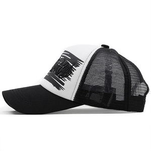 Close-up of black and white trucker hat with New York embroidery and mesh backing