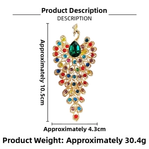 Detailed view of peacock brooch with multicolored rhinestones and 10.5cm size markings