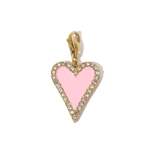 Detailed view of pink heart pendant with gold plating, sparkling rhinestones and lobster clasp