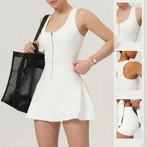 White sleeveless tennis dress with front zipper, flared skirt, and built-in safety shorts