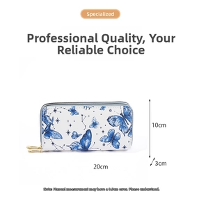 White butterfly print wallet detail with dimensions 20cm x 10cm x 3cm and dual gold zippers